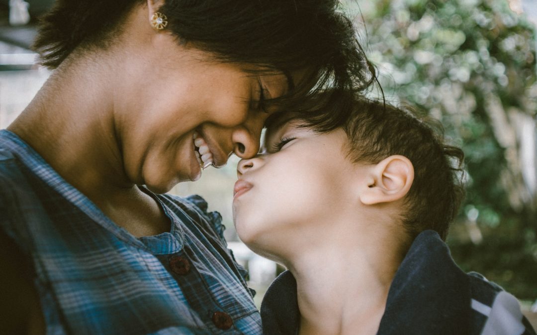 selective focus photography of woman and boy